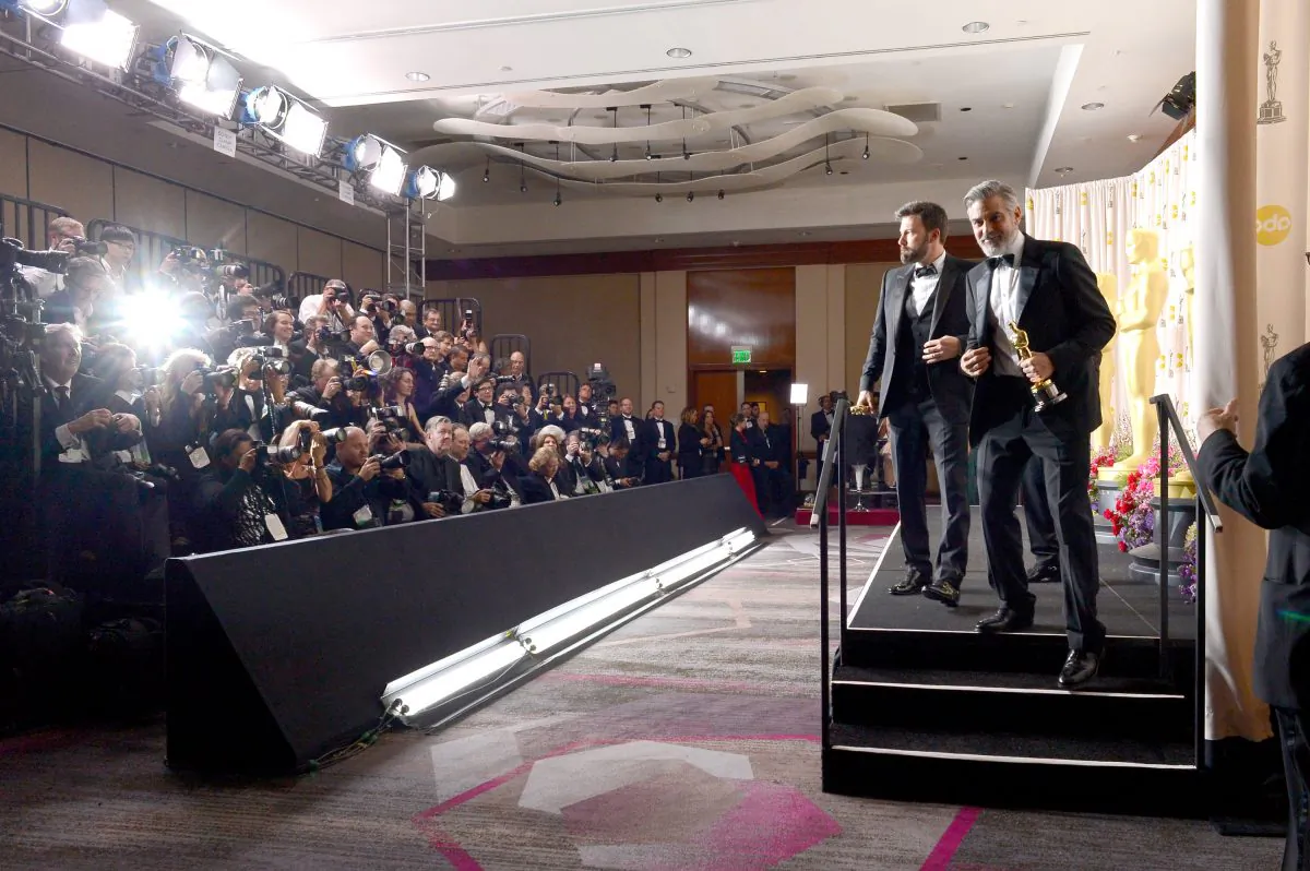 Actor/producer/director Ben Affleck and producer George Clooney posee with the Best Picture award for 'Argo' in the press room during the Oscars held at Loews Hollywood Hotel in Hollywood, Calif. on February 24, 2013. (Kevork Djansezian/Getty Images)