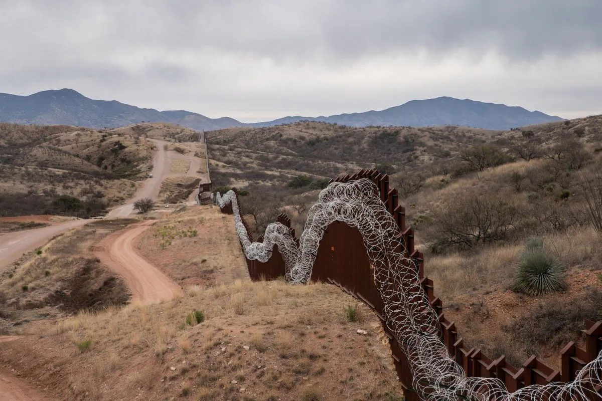 A general view of the U.S. border fence, covered in concertina wire, separating the United States and Mexico, at the outskirts of Nogales, Arizona, on Feb. 9, 2019. (Ariana Drehsler/AFP/Getty Images)