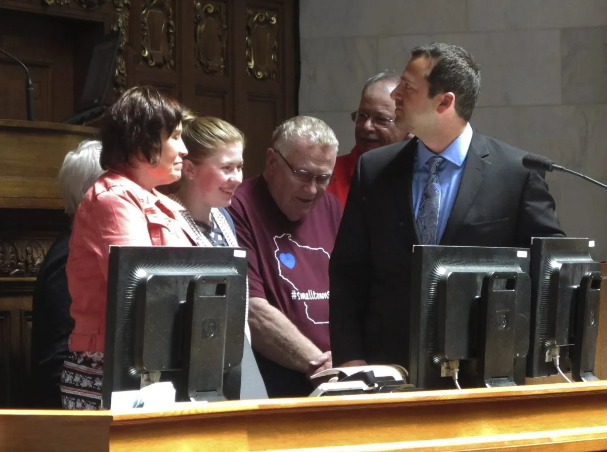 Kidnapping victim Jayme Closs, second from left, appears with her family and supporters to receive a "hometown hero" award from the Wisconsin Assembly in Madison, Wis. on May 15, 2019. (AP Photo/Scott Bauer)