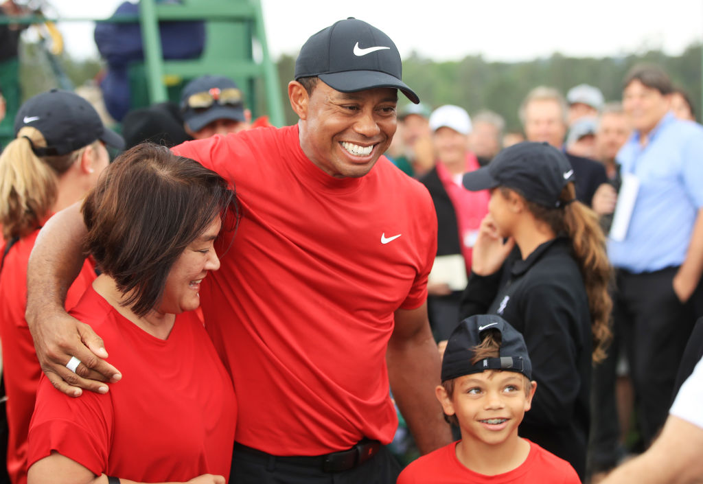 Tiger Woods celebrates with his son Charlie Axel during the final round of the Masters at Augusta National Golf Club in Augusta, Ga., on April 14, 2019. (Andrew Redington/Getty Images)