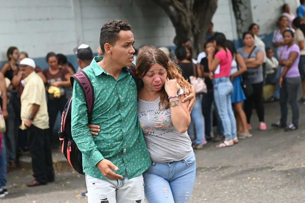 Relatives of prisoners killed during clashes at a police detention center in the town of Acarigua, in the Venezuelan state of Portuguesa, wait outside a hospital's morgue to be handed the bodies of their loved ones, on May 25, 2019. (Marvin Recinos/AFP/Getty Images)