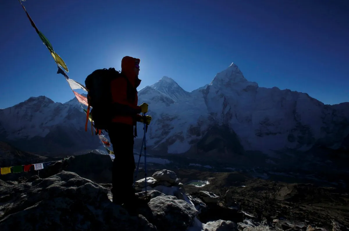A trekker stands in front of Mount Everest in this file photo. (Reuters/Navesh Chitrakar/File Photo)
