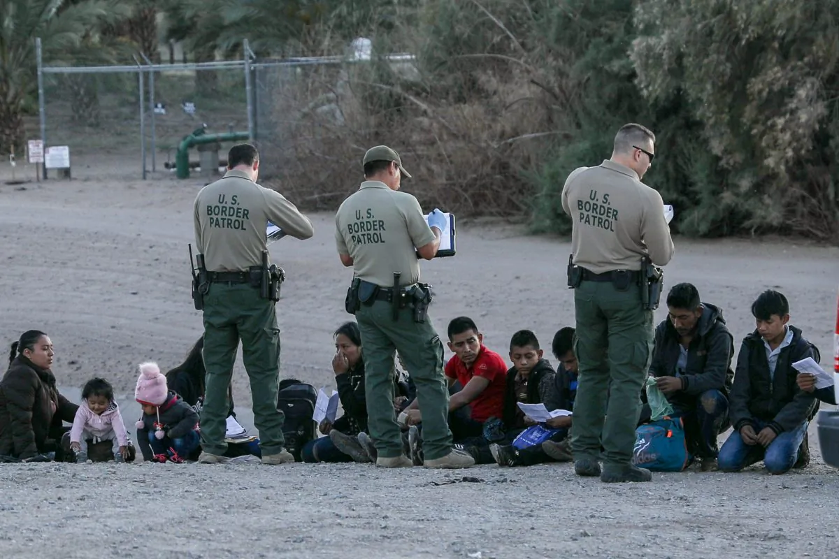 A group of illegal aliens is apprehended by Border Patrol after crossing from Mexico into Yuma, Ariz., on April 12, 2019. (Charlotte Cuthbertson/The Epoch Times)