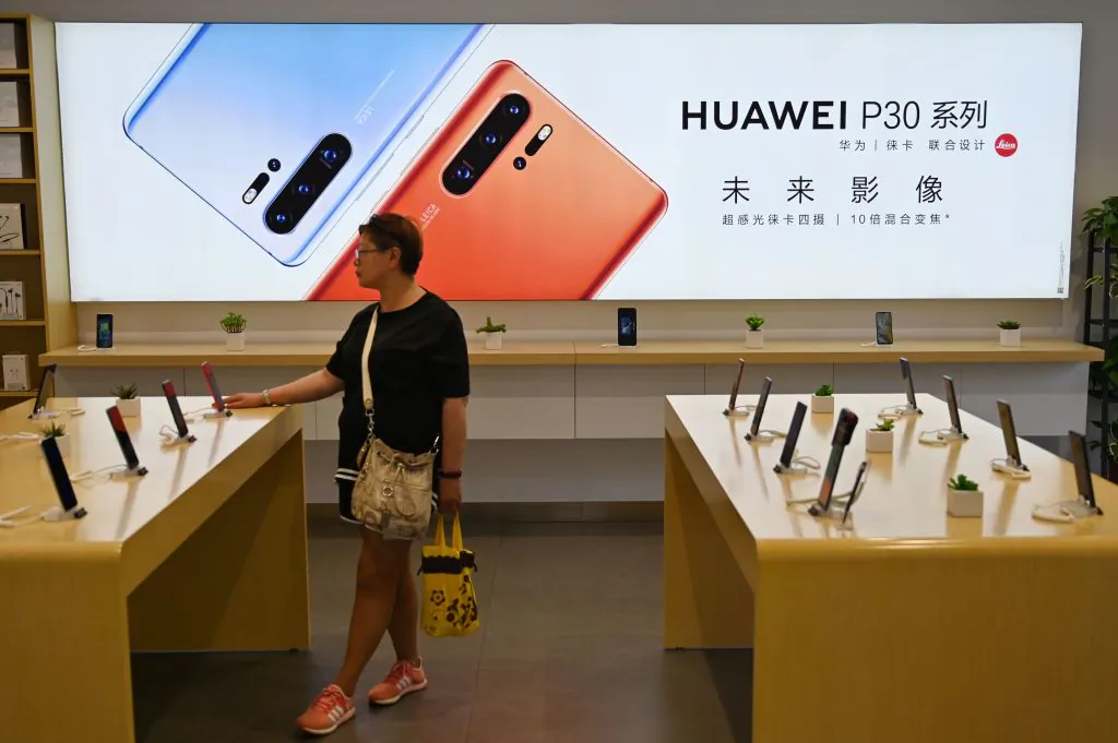 People browse for items in a Huawei store in Shanghai on May 24, 2019.  (HECTOR RETAMAL/AFP/Getty Images)