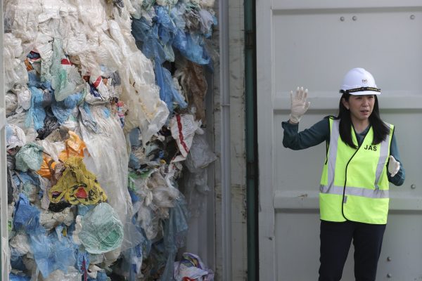 Malaysia's Minister of Energy, Science, Technology, Environment and Climate Change Yeo Bee Yin shows plastic waste