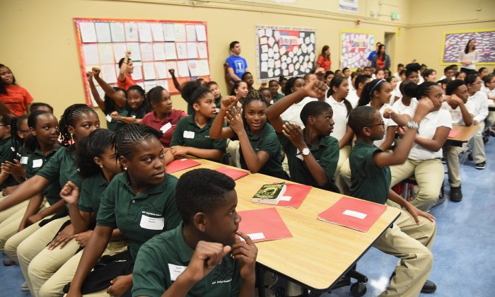 Bay Area students are surprised with new instruments at KIPP Bridge Charter School in San Francisco on Aug. 12, 2014. (Michael Buckner/Getty Images for StubHub)