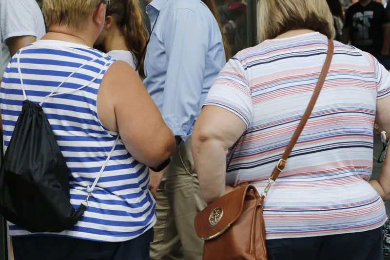 Two overweight women in New York on Aug. 16, 2016. (Mark Lennihan/File Photo via AP)