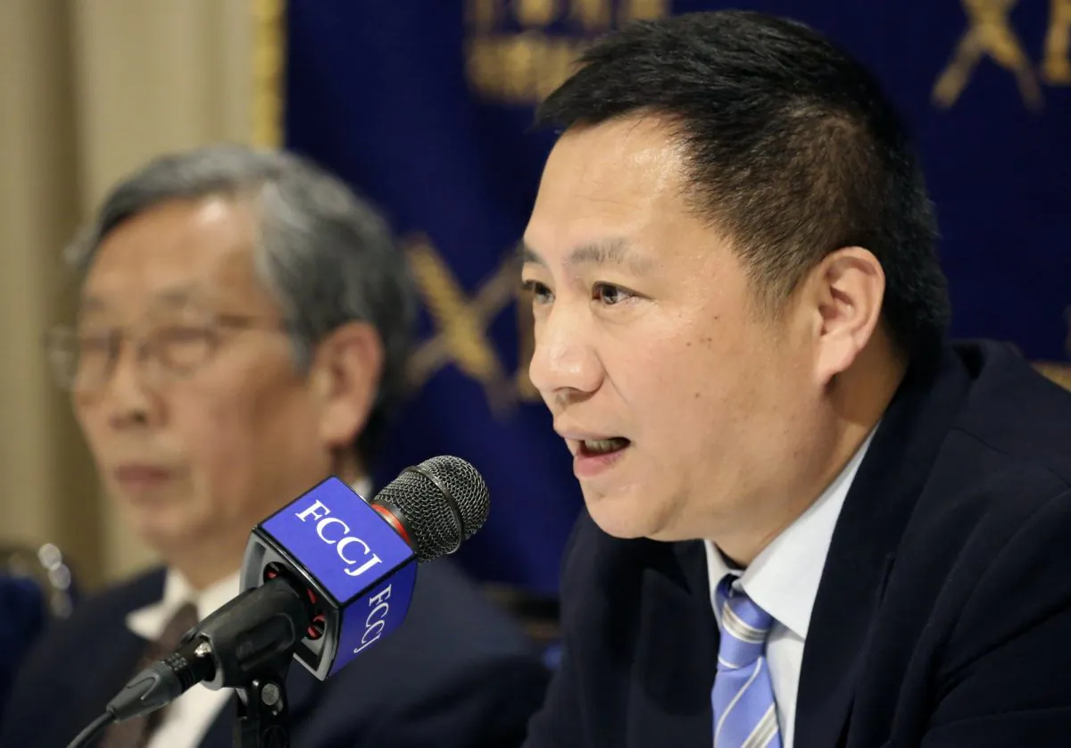 Veteran Chinese dissident Wang Dan speaks during a press conference in Tokyo on May 29, 2019. Wang is urging Western nations to restore the link between human rights and trade with China in the press conference, days ahead of the 30th anniversary of the 1989 student pro-democracy protests centered on Beijing’s Tiananmen Square, of which he was a key leader. Former chief editor of the Beijing Spring Magazine Hu Ping is seen at left.(Koji Sasahara/AP)