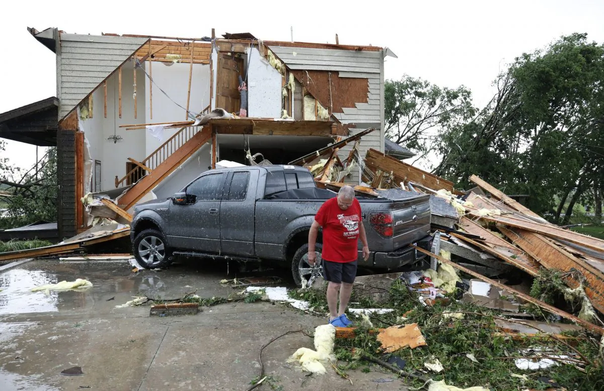 Joe Armison looks over damage to his home after a tornado struck the outskirts of Eudora, Kan., on May 28, 2019. (Colin E. Braley/AP
