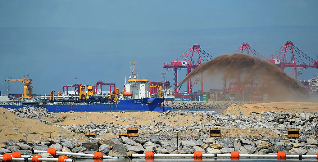 A dredger pumps sand to reclaim land just outside the Colombo Port on Nov. 23, 2016. (Ishara S. Kodikara/AFP/Getty Images)
