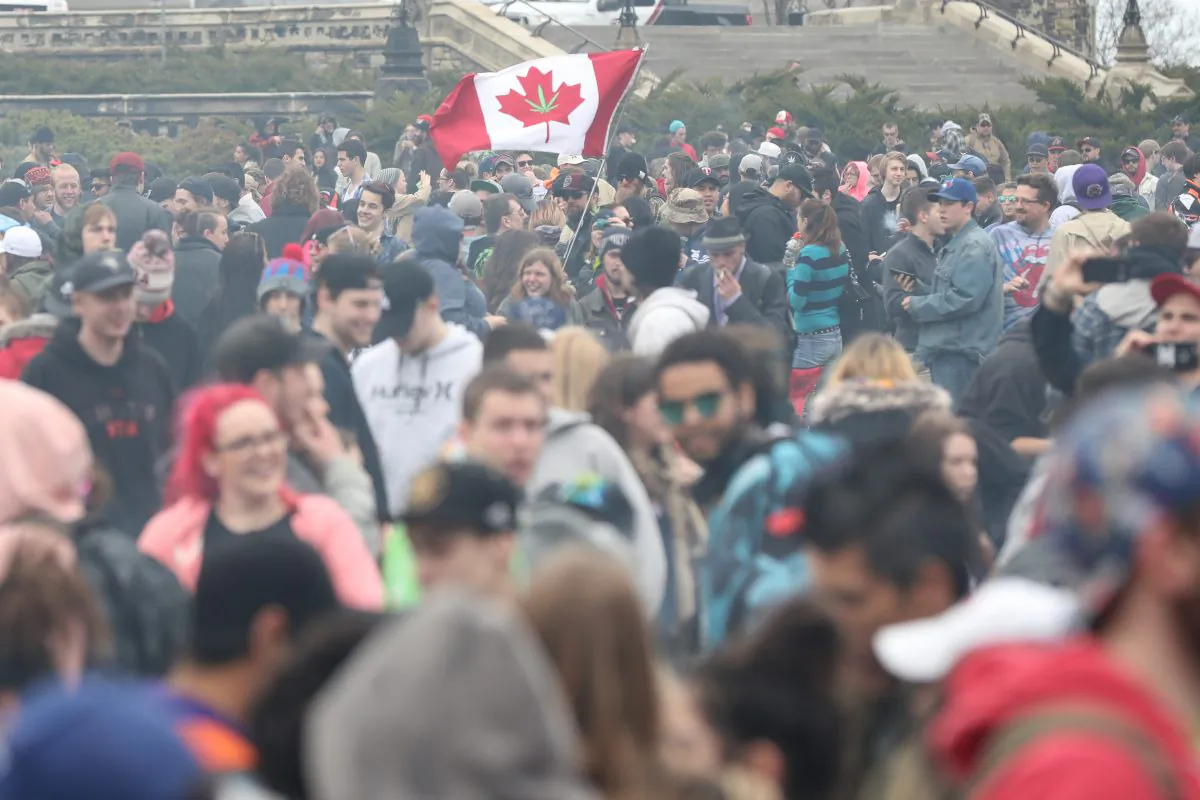 Marijuana smoke lingers around from people smoking weed on Parliament Hill on 4/20 in Ottawa, Ontario, April 20, 2017. 
LARS HAGBERG/AFP/Getty Images