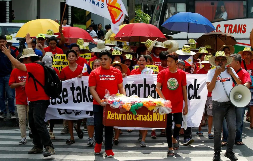 Environmentalists march outside the Canadian Embassy in the Philippines May 21, 2019, to demand the Canadian government speed up the removal of several containers of garbage that were shipped to the country in 2013/14. (Bullit Marquez/AP/The Canadian Press)