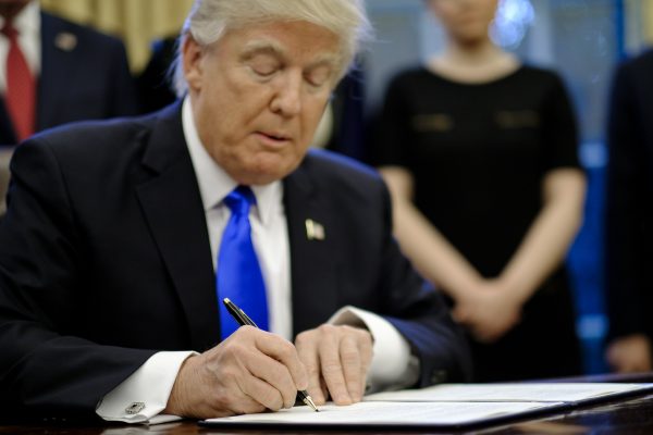 President Donald Trump signs three executive actions
