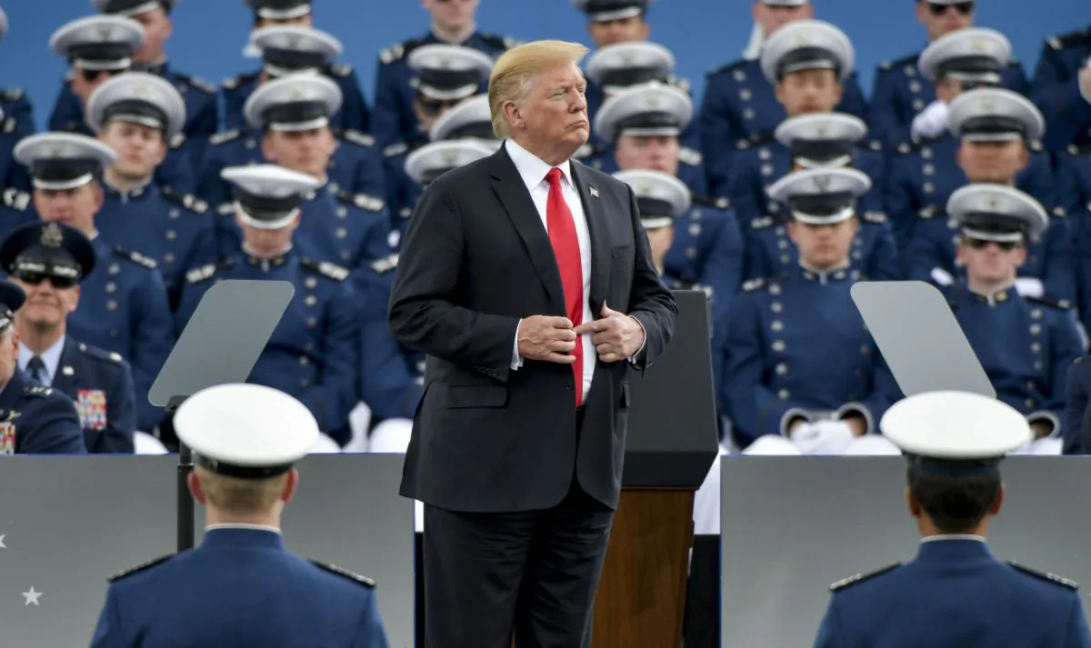 President Donald Trump waits to shake hands with United States Air Force Academy cadets as they receive their diplomas during their graduation ceremony at Falcon Stadium on May 30, 2019 in Colorado Springs, Colorado. (Michael Ciaglo/Getty Images)