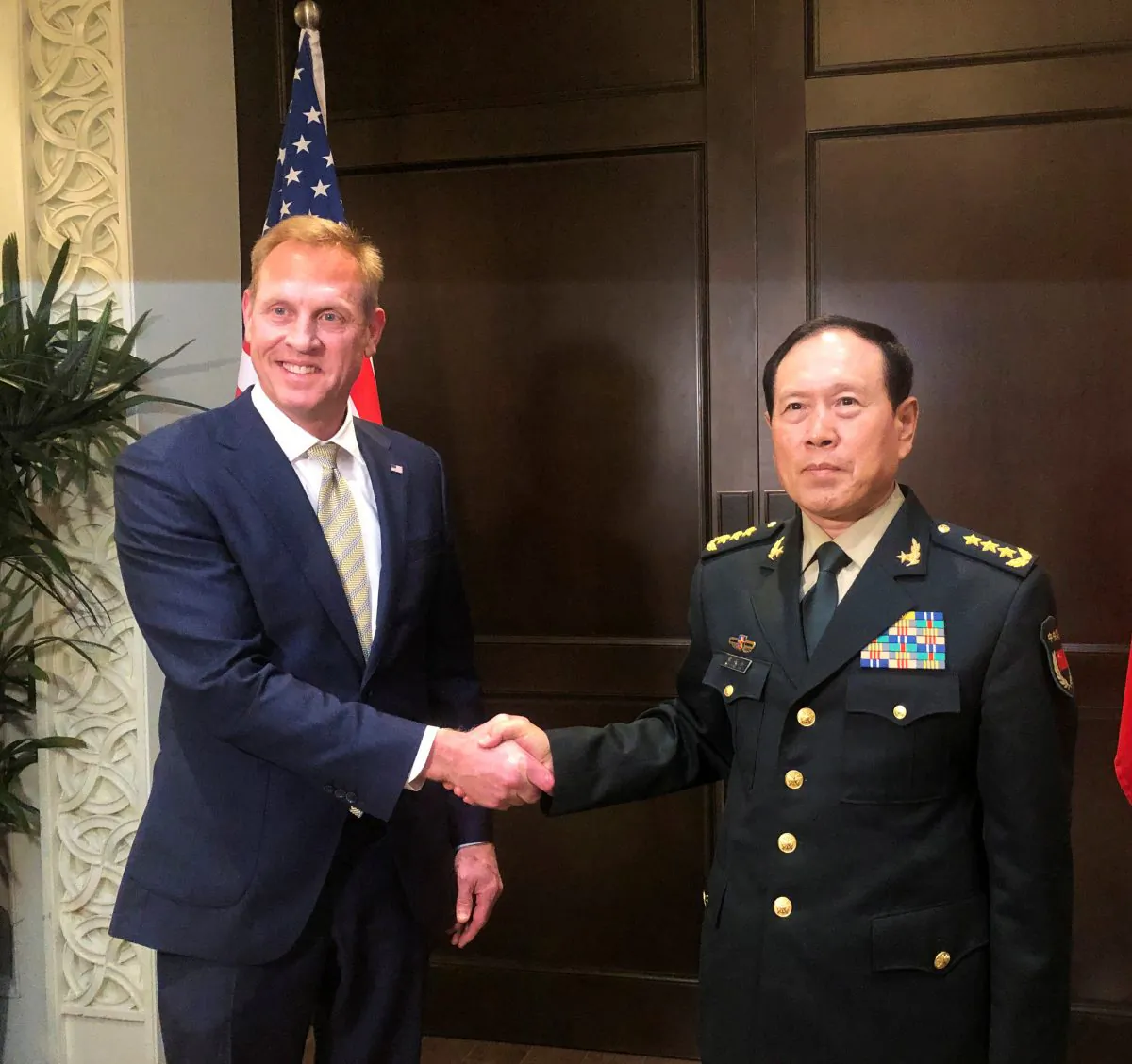 Acting U.S. Defense Secretary Patrick Shanahan and Chinese Defense Minister Wei Fenghe meet before the start of their meeting in Singapore on the sidelines of the Shangri-La dialogue on May 31, 2019. (Idrees Ali/Reuters)