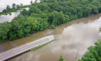 Hundreds of Roads Under Water as Historic Flooding Breaches Levees and Threatens Communities