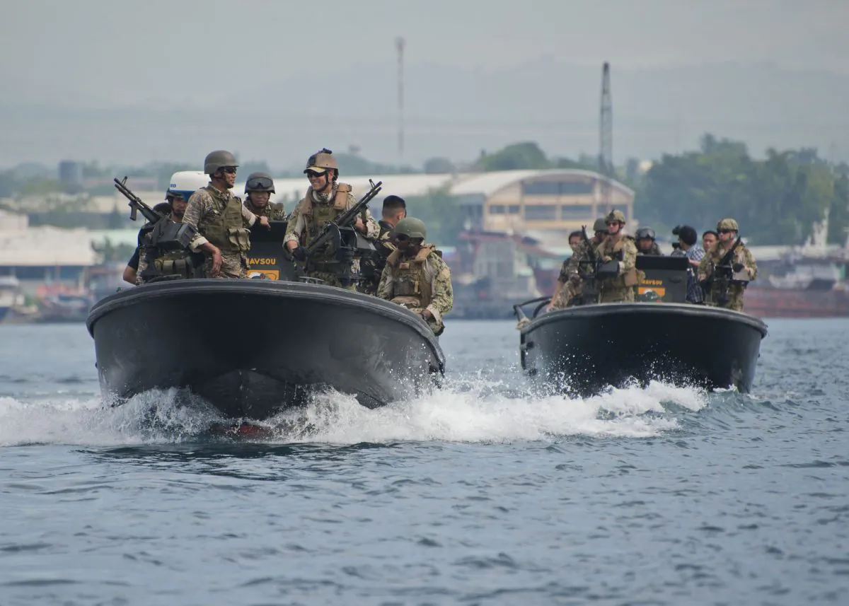 U.S. Navy Riverine Squadron 3 sailors work with Philippine Navy SEALS in the South China Sea. (U.S. Navy photo by Mass Communication Specialist 3rd Class Gregory A. Harden II)