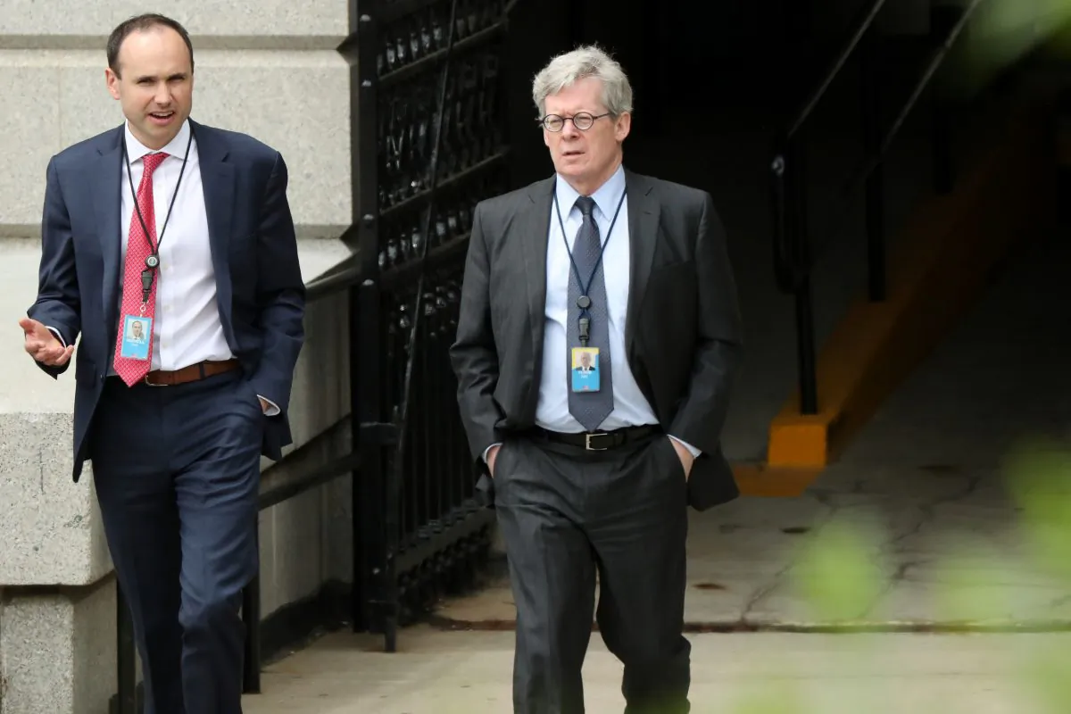 White House legal counsel Emmet Flood (R), walking with Associate Counsel David Morrell, exits the Eisenhower Executive Office Building on the White House campus in Washington, U.S. May 8, 2019. (Reuters/Jonathan Ernst/File Photo)