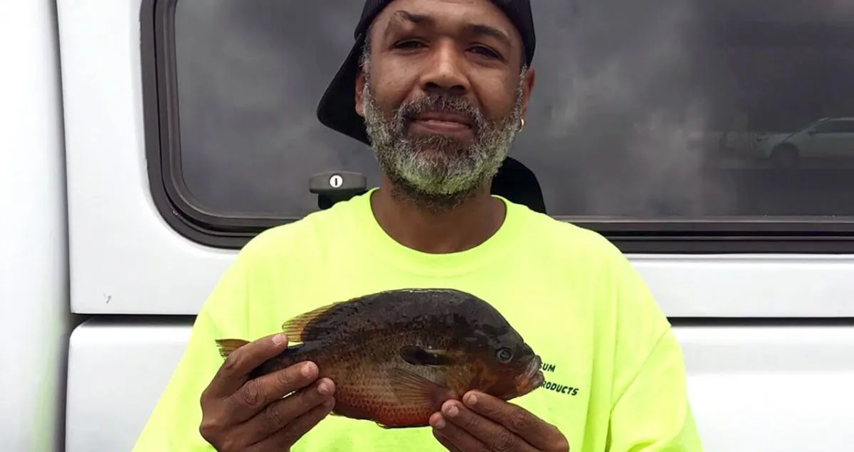 Maxton resident Alphonso Jackson, 43, broke a freshwater fish state record when he caught this redbreast sunfish in Wagram, N.C., on June 10, 2019. (North Carolina Wildlife Resources Commission)