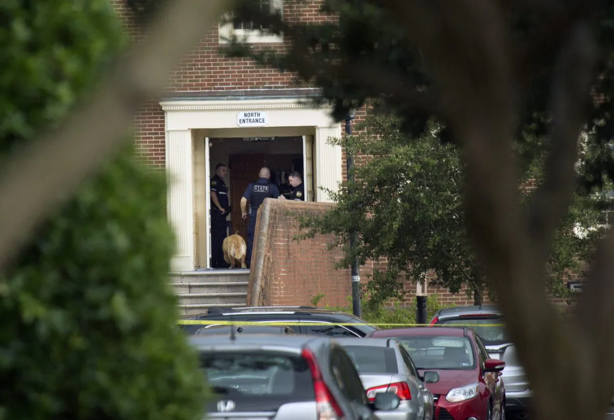 Police work the scene where 11 people were killed during a mass shooting at the Virginia Beach city public works building in Virginia Beach, Va., on May 31, 2019. (L. Todd Spencer/The Virginian-Pilot via AP)