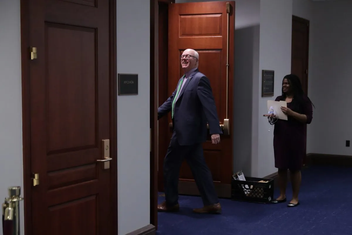 Then-Rep. Joe Crowley (D-N.Y.) jokes with journalists as he heads into a Democratic caucus meeting in Washington on Nov. 14, 2018. After losing his seat to Alexandria Ocasio-Cortez in the 2018 elections, Crowley signed up as a lobbyist.  (Chip Somodevilla/Getty Images)