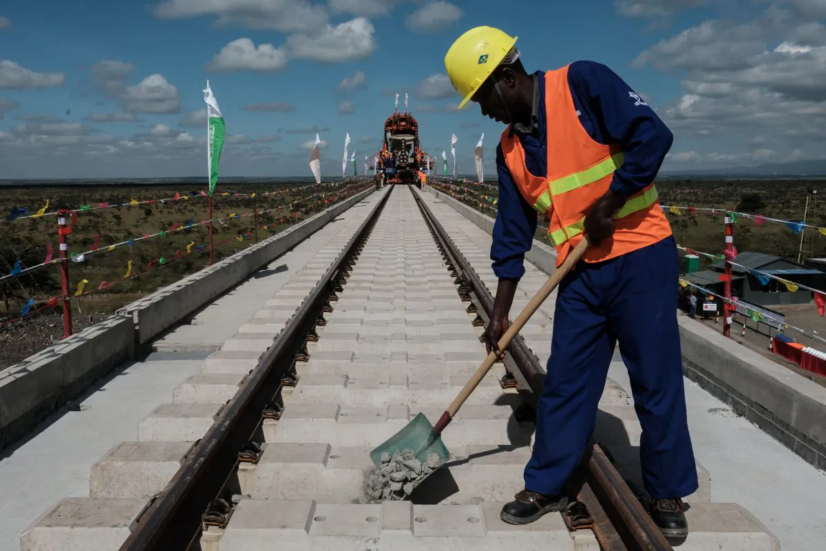 A Kenyan worker puts gravel at the construction site of Standard Gauge Railway (SGR) near Nairobi, Kenya, on June 23, 2018. (Yasuyoshi Chiba/AFP/Getty Images)