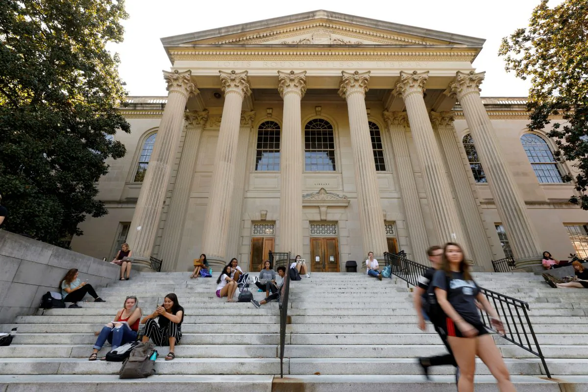 Students sit on the steps of Wilson Library on the campus of University of North Carolina at Chapel Hill, N.C., on Sept. 20, 2018. (Jonathan Drake/Reuters)