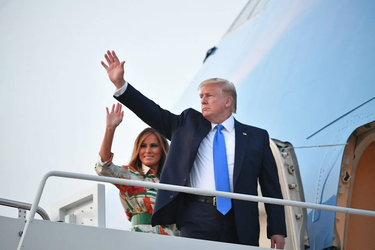President Donald Trump and First Lady Melania Trump make their way to board Air Force One before departing from Andrews Air Force Base in Maryland on June 2, 2019. (Mandel Ngan/AFP/Getty Images)