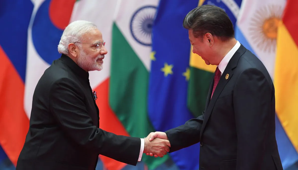 India's Prime Minister Narendra Modi (L) shakes hands with China's leader Xi Jinping before the G20 leaders' family photo in Hangzhou, China, on Sept. 4, 2016. (Greg Baker/AFP/Getty Images)