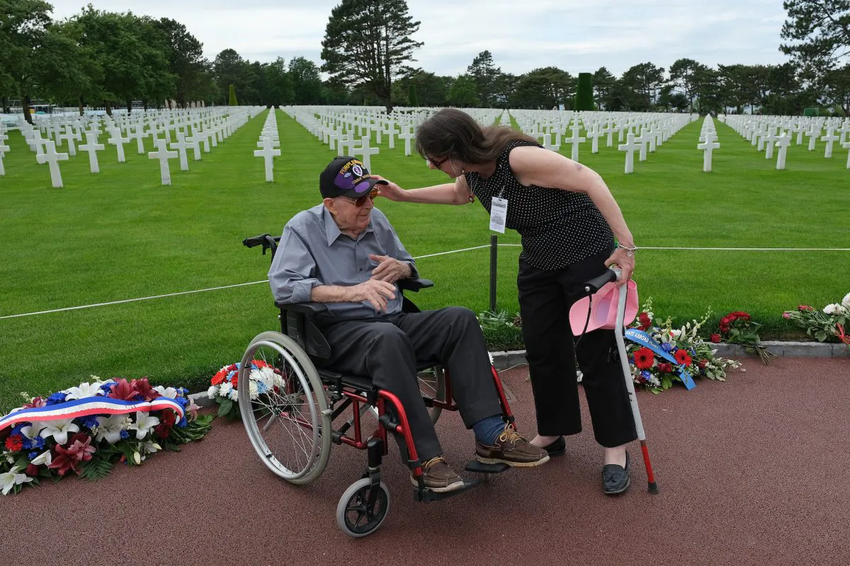 U.S. D-Day veteran Leonard Jindra, 98, speaks with his daughter following a ceremony at Normandy American Cemetery near Colleville-sur-Mer, France, on June 2, 2019. (Sean Gallup/Getty Images)