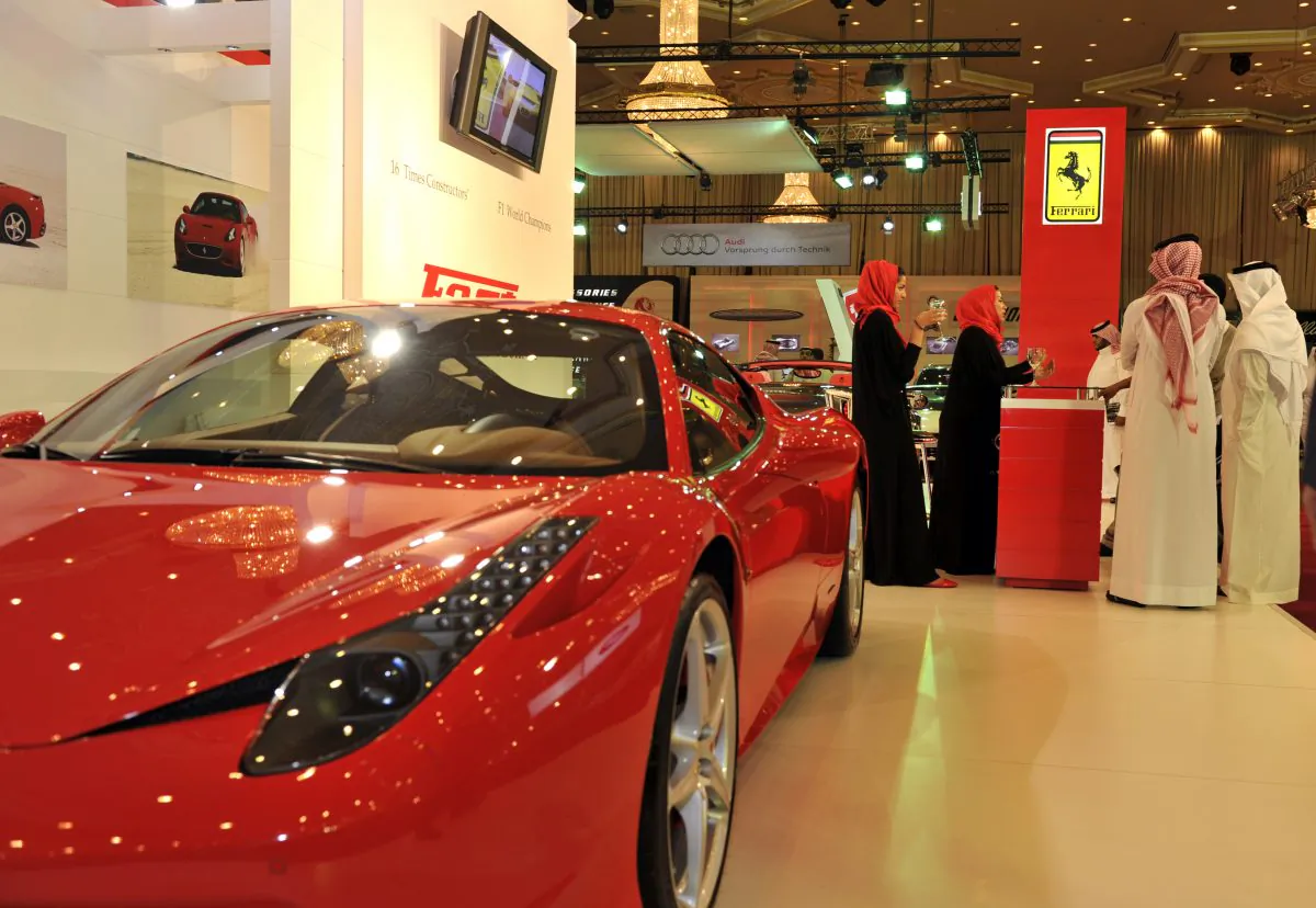 Saudi men visit the Ferrari stand at the International Luxury Motor Show in Jeddah in a file photo. (Amer Hilabi/AFP/Getty Images)
