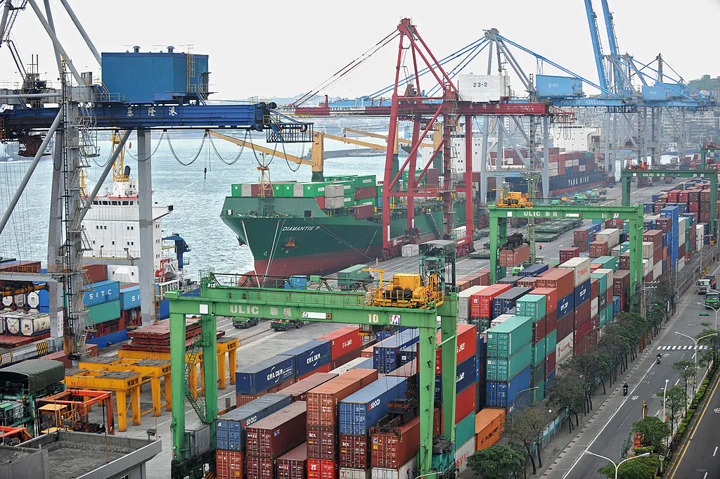 Cargo containers are unloaded at the Keelung port in Taiwan on Dec. 7, 2010. (Patrick Lin/AFP/Getty Images)