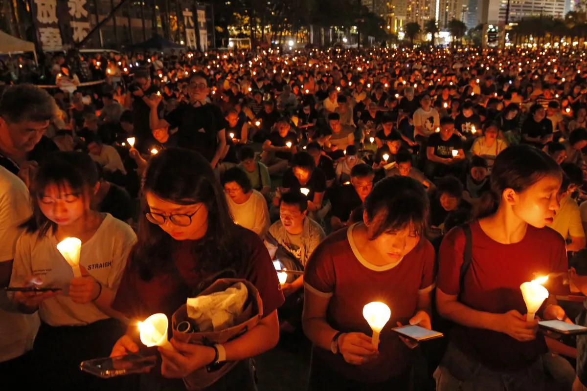 Thousands of people attend a candlelight vigil for victims of the Chinese government's brutal military crackdown three decades ago on protesters in Beijing's Tiananmen Square at Victoria Park in Hong Kong, June 4, 2019. (Kin Cheung/AP Photo)