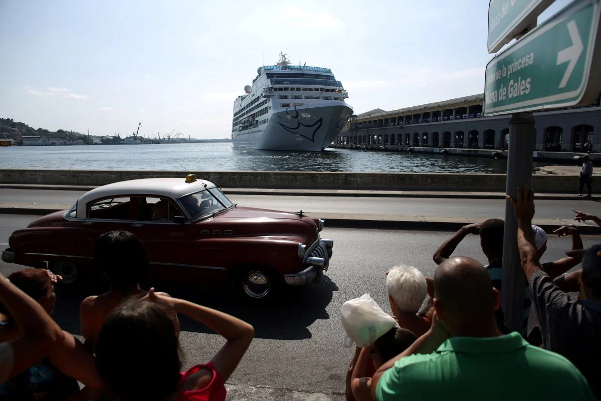 People look at the arrival of U.S. Carnival cruise ship Adonia at the Havana bay, the first cruise liner to sail between the United States and Cuba since Cuba's 1959 revolution, Cuba, on May 2, 2016. (Alexandre Meneghini/File Photo/Reuters)