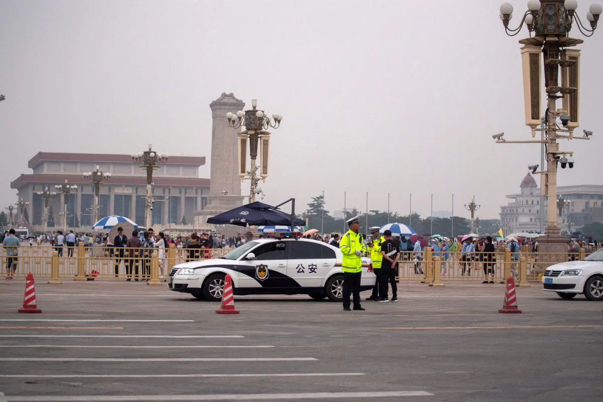 Police officers stand in front of Tiananmen Square in Beijing on June 4, 2019. (MATHEW KNIGHT/AFP/Getty Images)