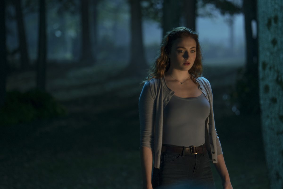 woman in grey sweater in woods