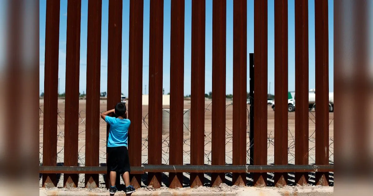 A child looks through the border wall during the visit of U.S. President Donald Trump to Calexico, California, as seen in Mexicali, Mexico, on April 5, 2019. (Reuters/Carlos Jasso)