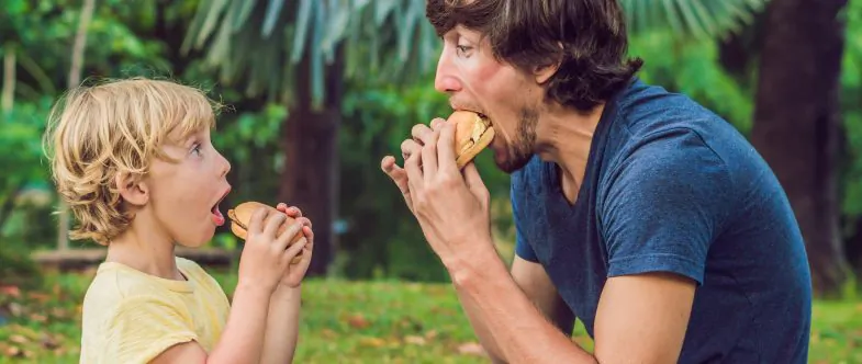 Fathers show us strength, love, and the best way to grill a burger. (Shutterstock)