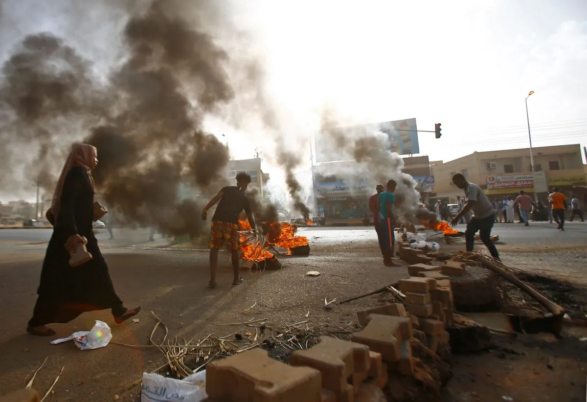 Sudanese protesters block Street 60 with burning tyres and pavers as military forces tried to disperse a sit-in outside Khartoum's army headquarters on Jun. 3, 2019. (Ashraf Shazly/AFP/Getty Images)