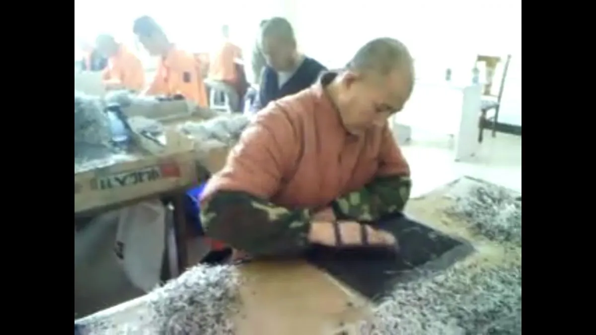 Undercover footage from Masanjia Forced Labor Camp in China showing inmates making diodes during the 2008 Beijing Olympics. (Courtesy of Yu Ming)