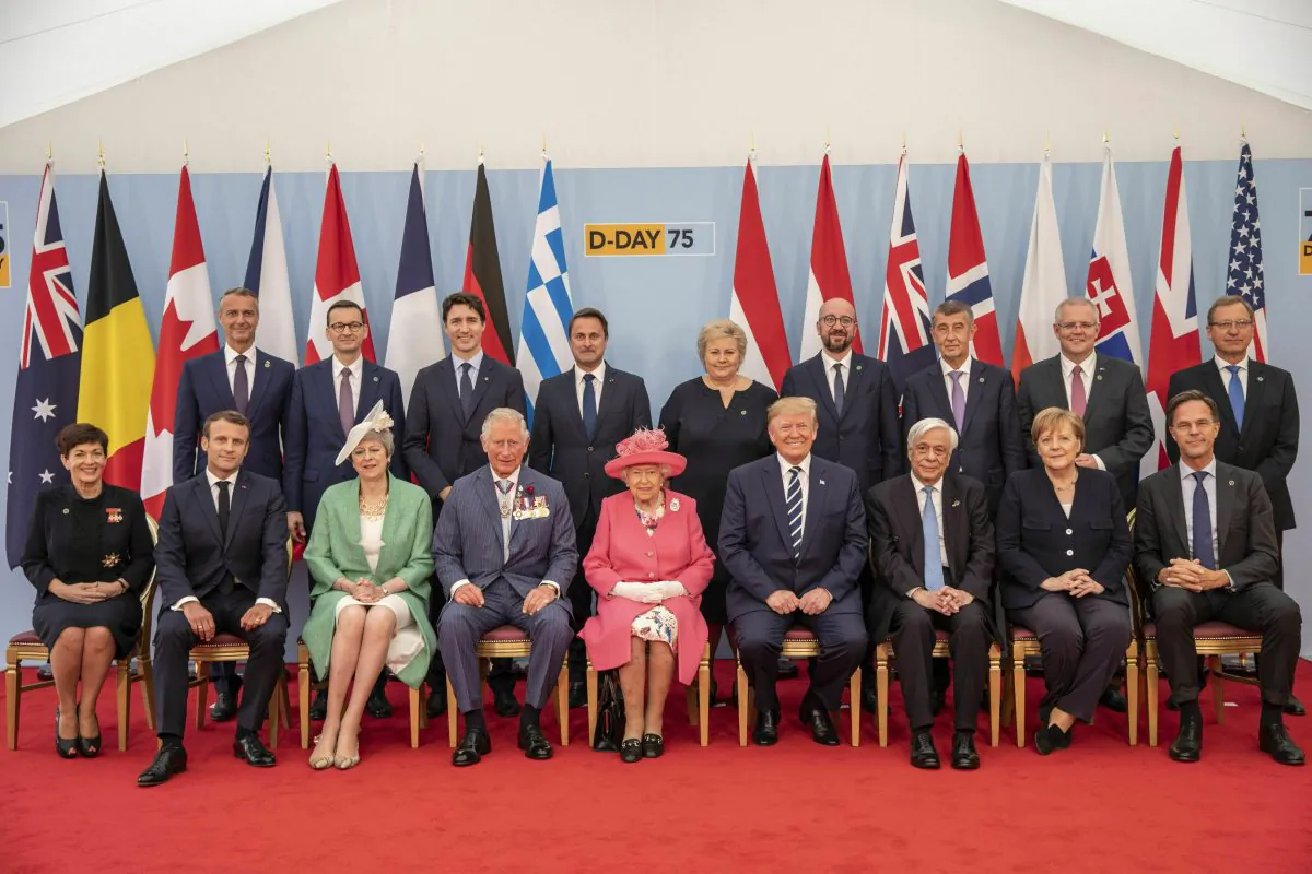 Britain's Queen Elizabeth II, accompanied by The Prince of Wales, pose for a formal photograph with leaders of the other Allied Nations ahead of the National Commemorative Event commemorating the 75th anniversary of D-Day, in Portsmouth, England on June 5, 2019. (Jack Hill/Pool via AP/The Canadian Press)