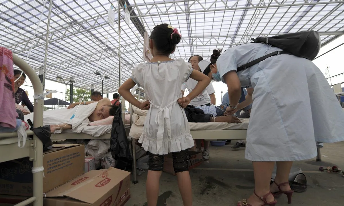 A girl standing at a hospital in China. (Liu Jin/AFP/Getty Images)