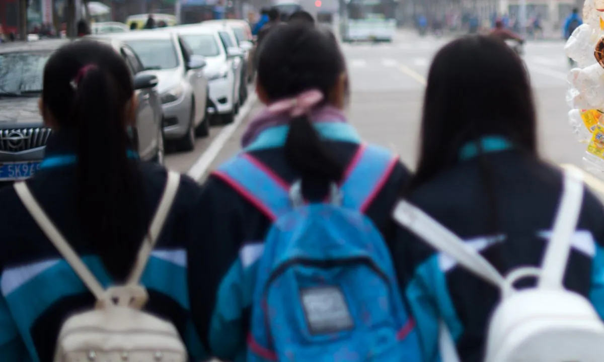 Chinese school girls walking together. (Johannes Eisele/AFP/Getty Images