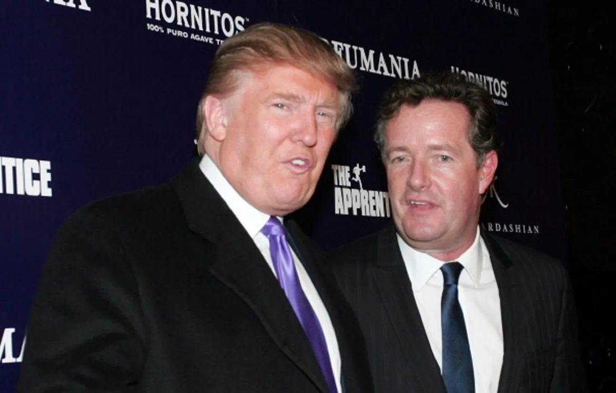 Donald Trump (L) and Piers Morgan celebrate Kim Kardashian's appearance on "The Apprentice" at Provacateur in New York, N.Y., on Nov. 10, 2010. (John W. Ferguson/Getty Images)