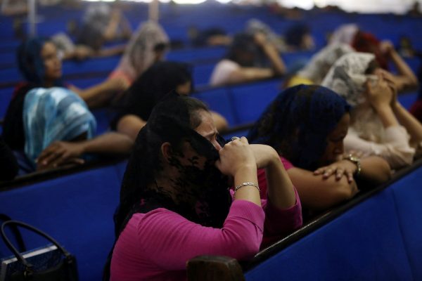 Devotees participate in a prayer vigil at the La Luz del Mundo (The Light of the World) church after its leader Naason Joaquin Garcia was arrested in California, in Guadalajara