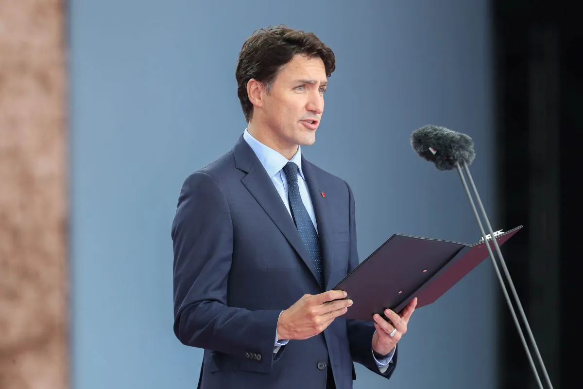 Canada's Prime Minister, Justin Trudeau, speaks on stage during an event to commemorate the 75th anniversary of D-Day in Portsmouth, Britain on June 5, 2019. (Chris Jackson/Pool via Reuters)