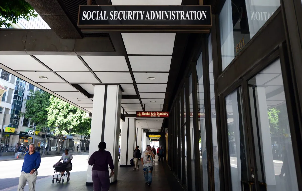 Pedestrians walk past the Social Security Administration office in Los Angeles, Calif., on Oct. 1, 2013. (Frederic J. Brown/AFP/Getty Images)