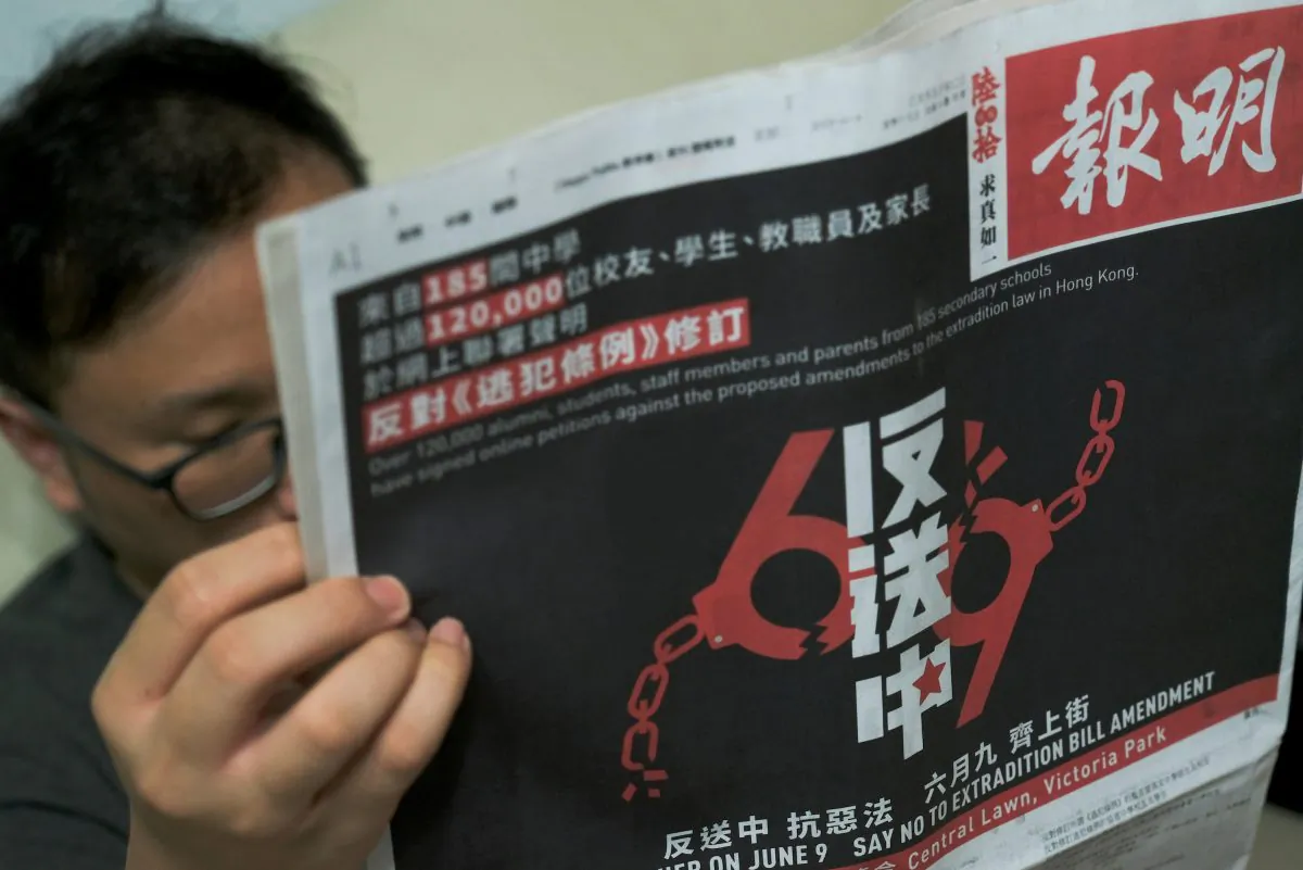 A front page of Hong Kong's newspaper Ming Pao with a joint petition against the so-called Fugitive Offenders Ordinance amendment bill, is seen in Hong Kong, China on June 4, 2019. (Tyrone Siu/Reuters)