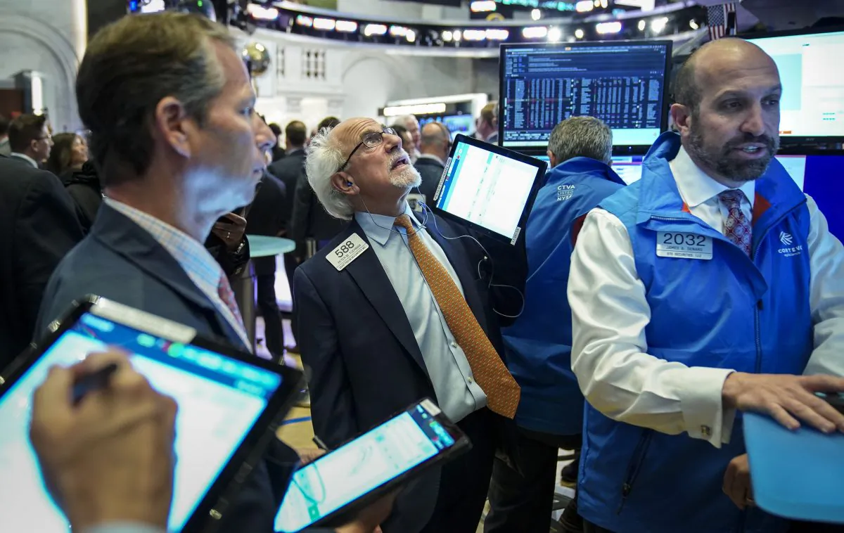 Traders and financial professionals work at the opening bell on the floor of the New York Stock Exchange on June 3, 2019. (Drew Angerer/Getty Images)