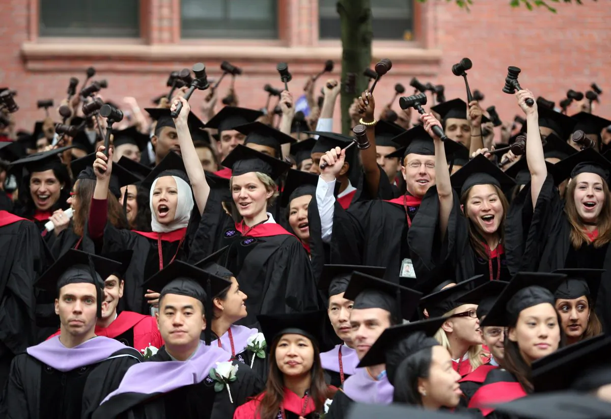 Graduating Harvard University Law School students stand and wave gavels in celebration at commencement ceremonies in Cambridge, Mass. on June 5, 2008. (Robert Spencer/Getty Images)